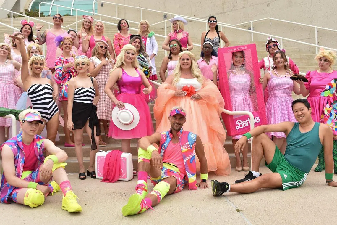 Barbie cosplayers pose outside the convention centre during San Diego Comic-Con International on July 20, 2023.