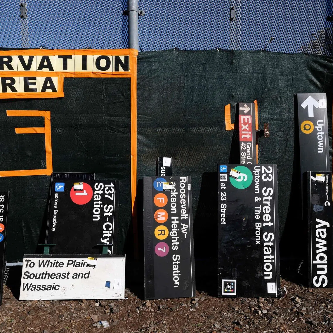 Signs from New York City’s transportation system are seen during NYC Transit’s annual pop-up sale in New York on Oct 9.