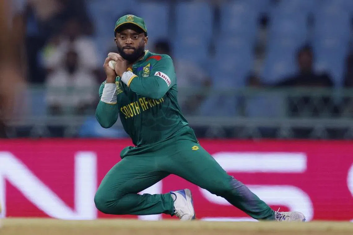 Cricket - ICC Cricket World Cup 2023 - Australia v South Africa - Bharat Ratna Shri Atal Bihari Vajpayee Ekana Cricket Stadium, Lucknow, India - October 12, 2023 South Africa's Temba Bavuma takes a catch to dismiss Australia's Marnus Labuschagne off the bowling of Keshav Maharaj REUTERS/Adnan Abidi/File Photo