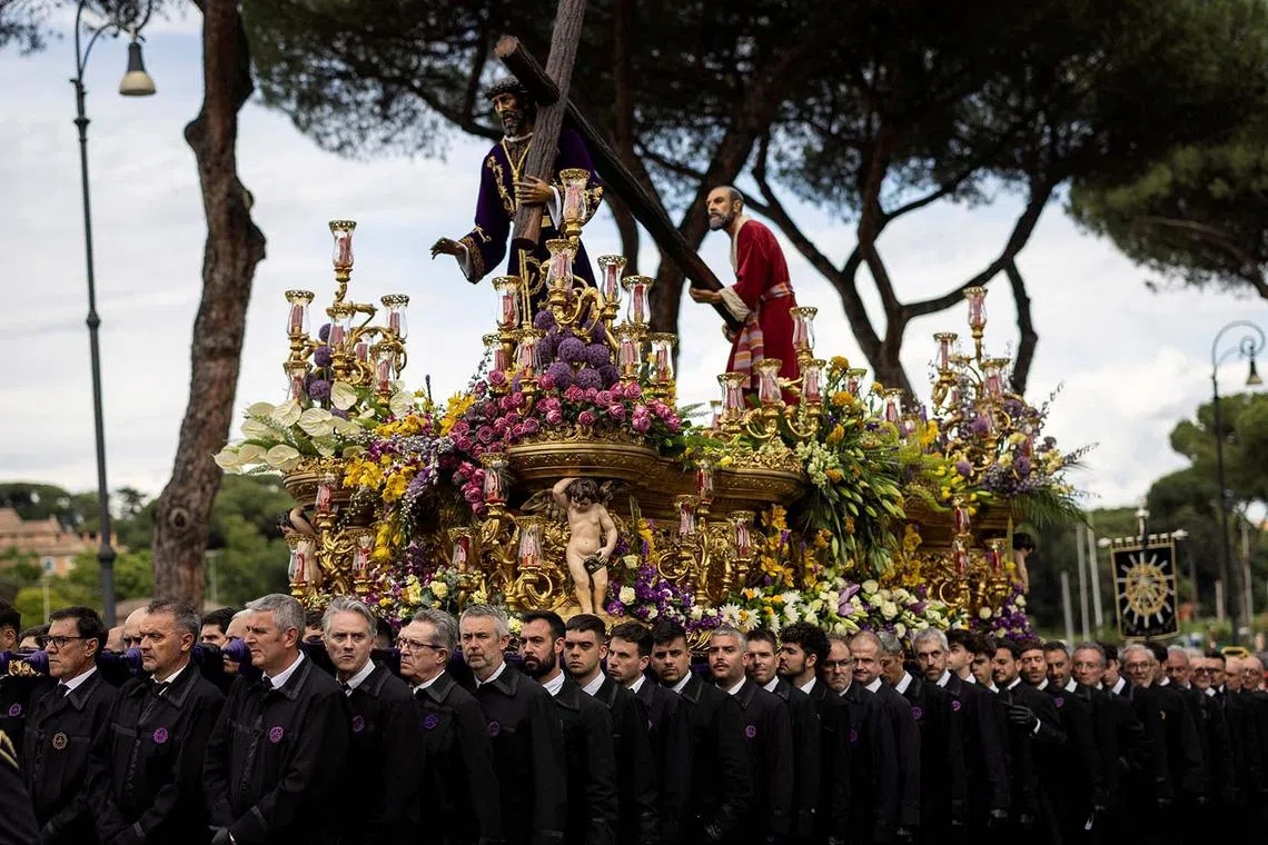 Pilgrims carrying a revered statue from Europe's confraternities, during the Grande Processione, in Rome, Italy, May 17, 2025.