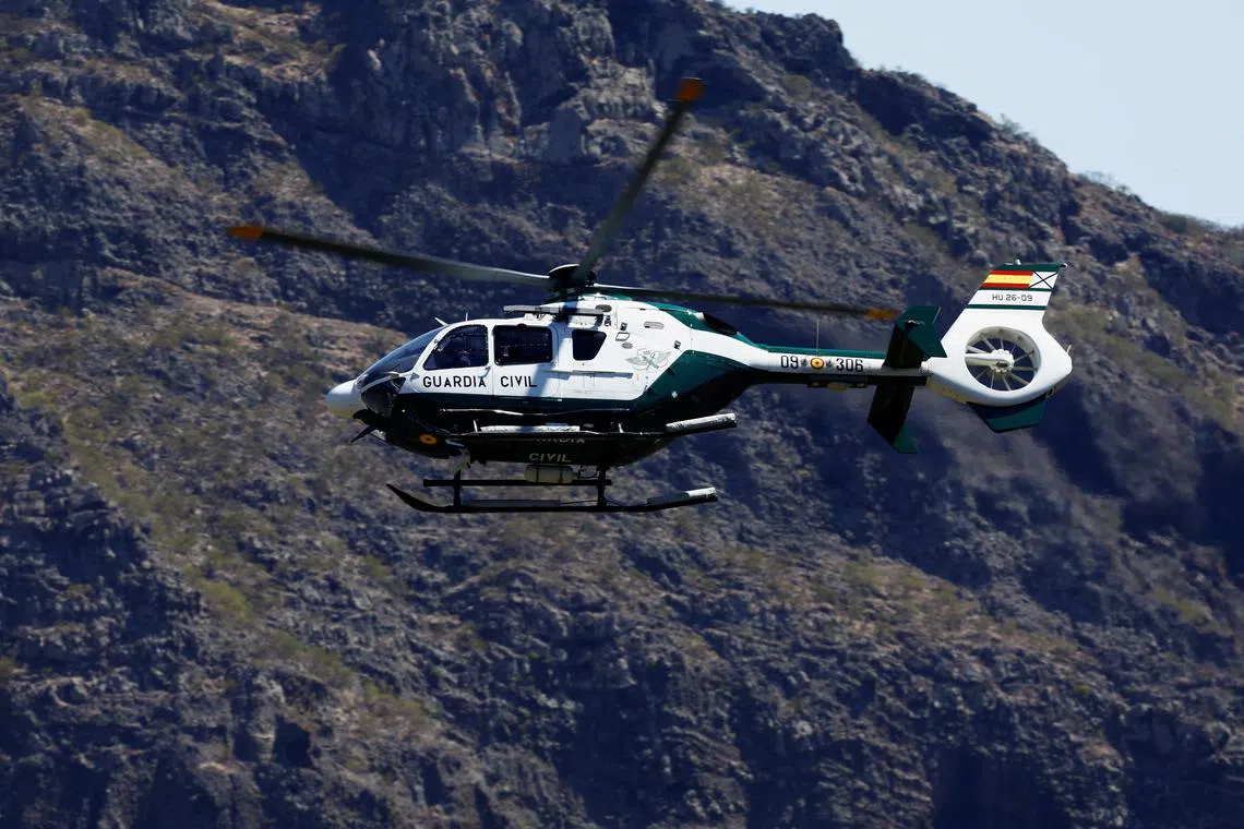FILE PHOTO: A Guardia Civil helicopter searches for the young Briton Jay Slater in the Masca ravine, on the island of Tenerife, Spain, June 29, 2024. REUTERS/Borja Suarez/File Photo