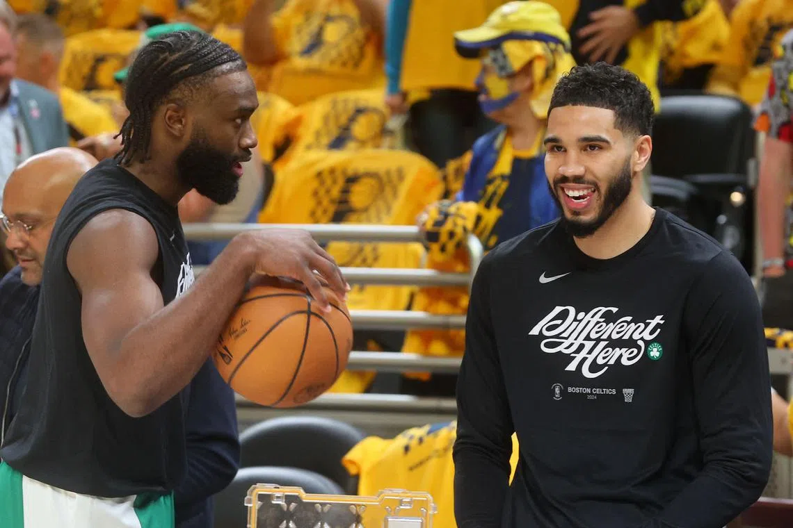Boston Celtics stars Jaylen Brown (left) and Jayson Tatum chatting during Game 3 of the Eastern Conference Finals against the Indiana Pacers at Gainbridge Fieldhouse on May 25. Boston won the series 4-0 and are leading the NBA Finals against the Dallas Mavericks 1-0.