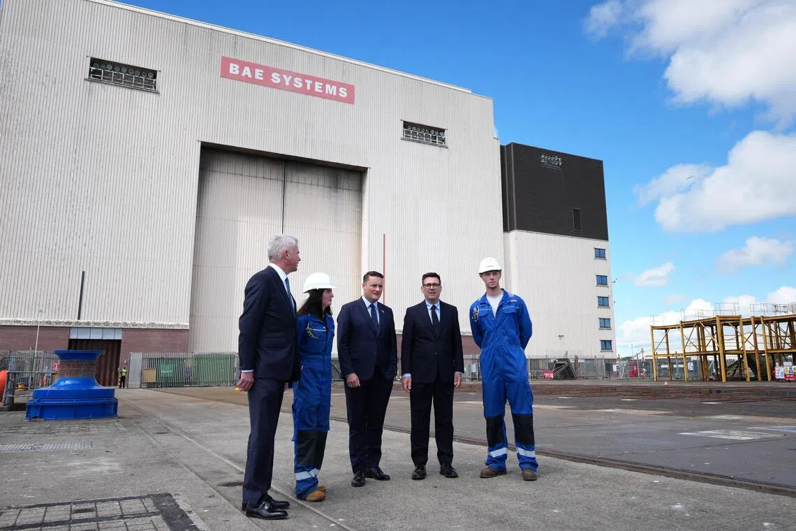 Britain’s Prime Minister Andy Burnham (second from right) and Defence Secretary Wes Streeting (centre) visiting the Submarine Academy for Skills and Knowledge (SASK), BAE Systems, on July 30.