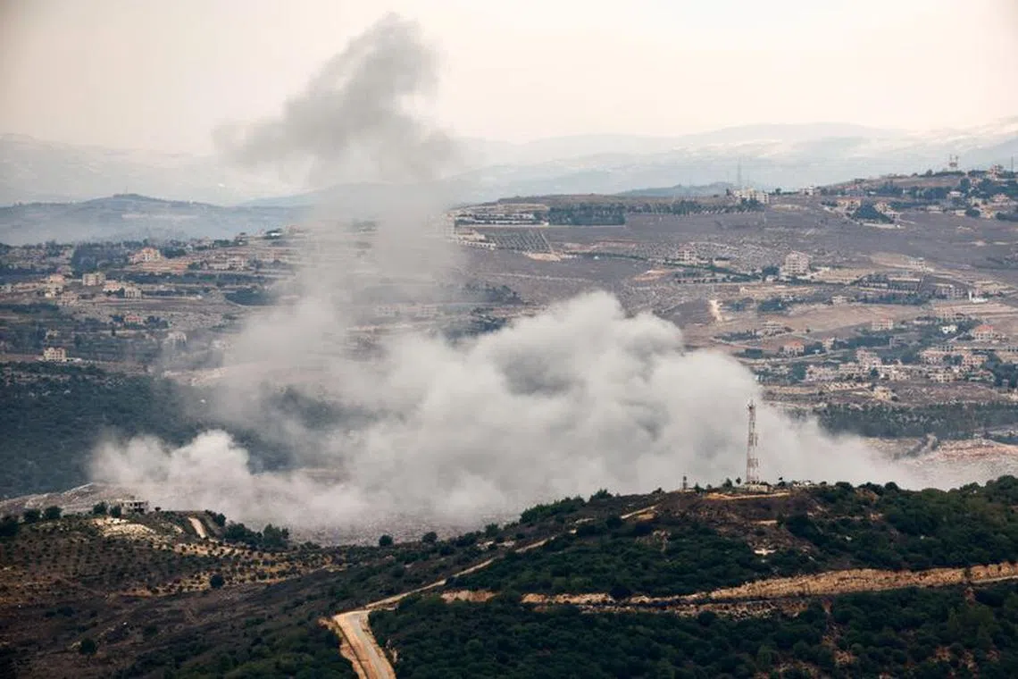 FILE PHOTO: Smoke rises as seen from Israel-Lebanon border in northern Israel, November 12, 2023. REUTERS/Evelyn Hockstein