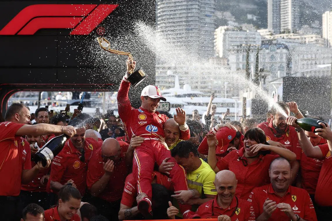 Formula One F1 - Monaco Grand Prix - Circuit de Monaco, Monaco - May 26, 2024
Ferrari's Charles Leclerc celebrates with team members after winning the Monaco Grand Prix REUTERS/Benoit Tessier
