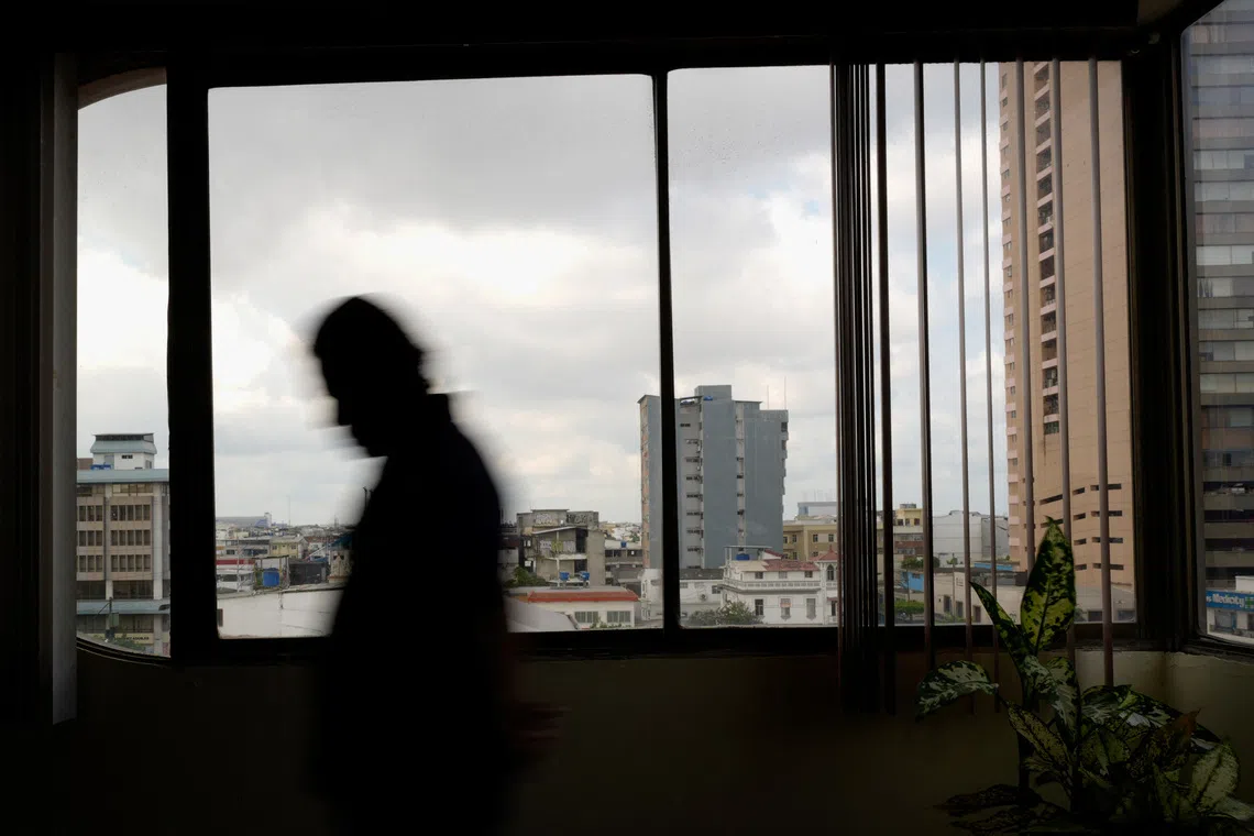A man displaced by gang violence poses for a photo during an interview as Ecuador experiences a sharp rise in internal displacement amid expanding criminal group control and territorial disputes, in Guayaquil, Ecuador, July 20, 2026. REUTERS/Santiago Arcos