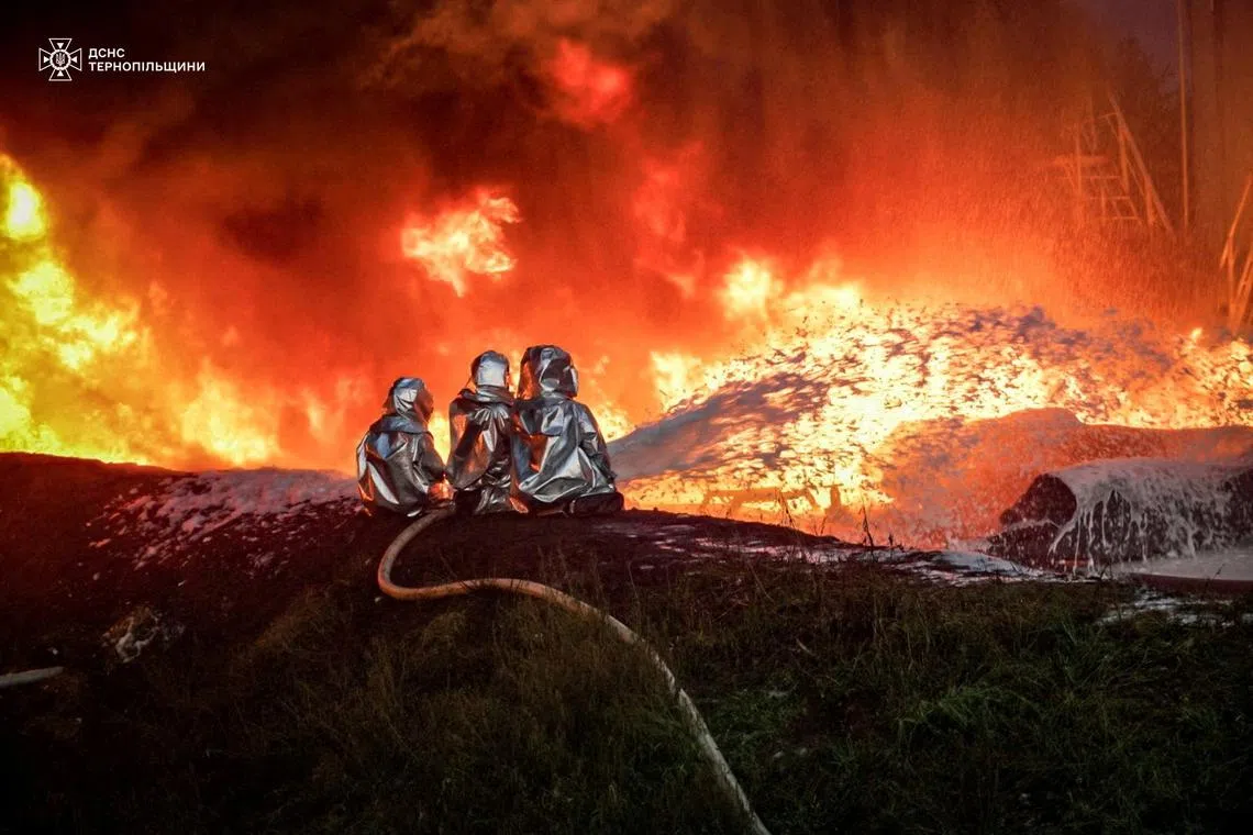 Firefighters work at a site of an infrastructure facility hit by a Russian drone strike, amid Russia's attack on Ukraine, in Ternopil region, Ukraine August 20, 2024. Press service of the State Emergency Service of Ukraine/Handout via REUTERS