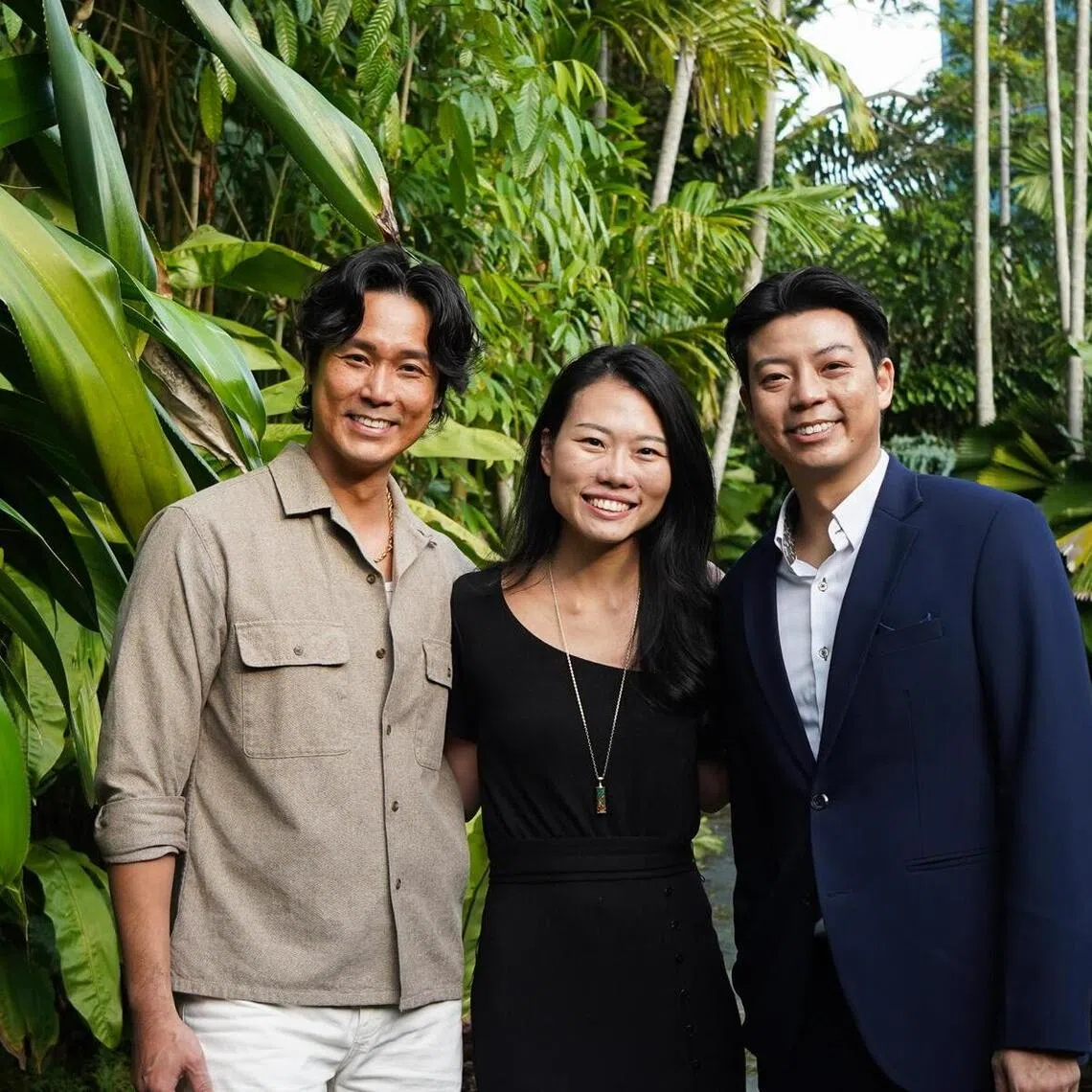 Local actor Andie Chen (left) and his brother Adam Tan - both of whom helm the Asia White Knight Group - with Ms Bonnie Wong, outgoing chief executive of Creative Eateries. 