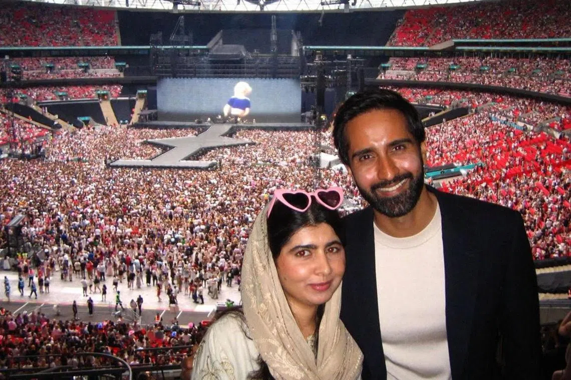 Pakistani activist Malala Yousafzai (left) with her husband Asser Malik at Taylor Swift's concert in London on Aug 16.