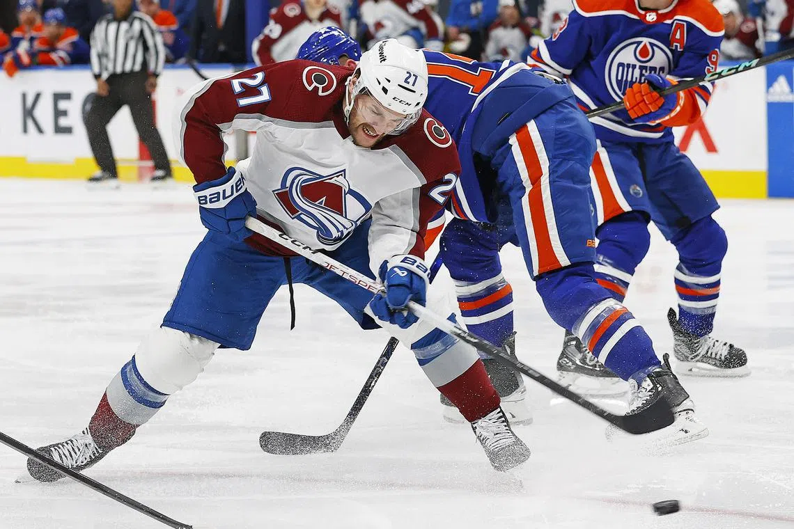 Apr 5, 2024; Edmonton, Alberta, CAN; Colorado Avalanche forward Jonathan Drouin (27) battles with Edmonton Oilers defensemen Mattias Ekholm (14) for ma loose puck during the second period at Rogers Place. Mandatory Credit: Perry Nelson-USA TODAY Sports/ File Photo