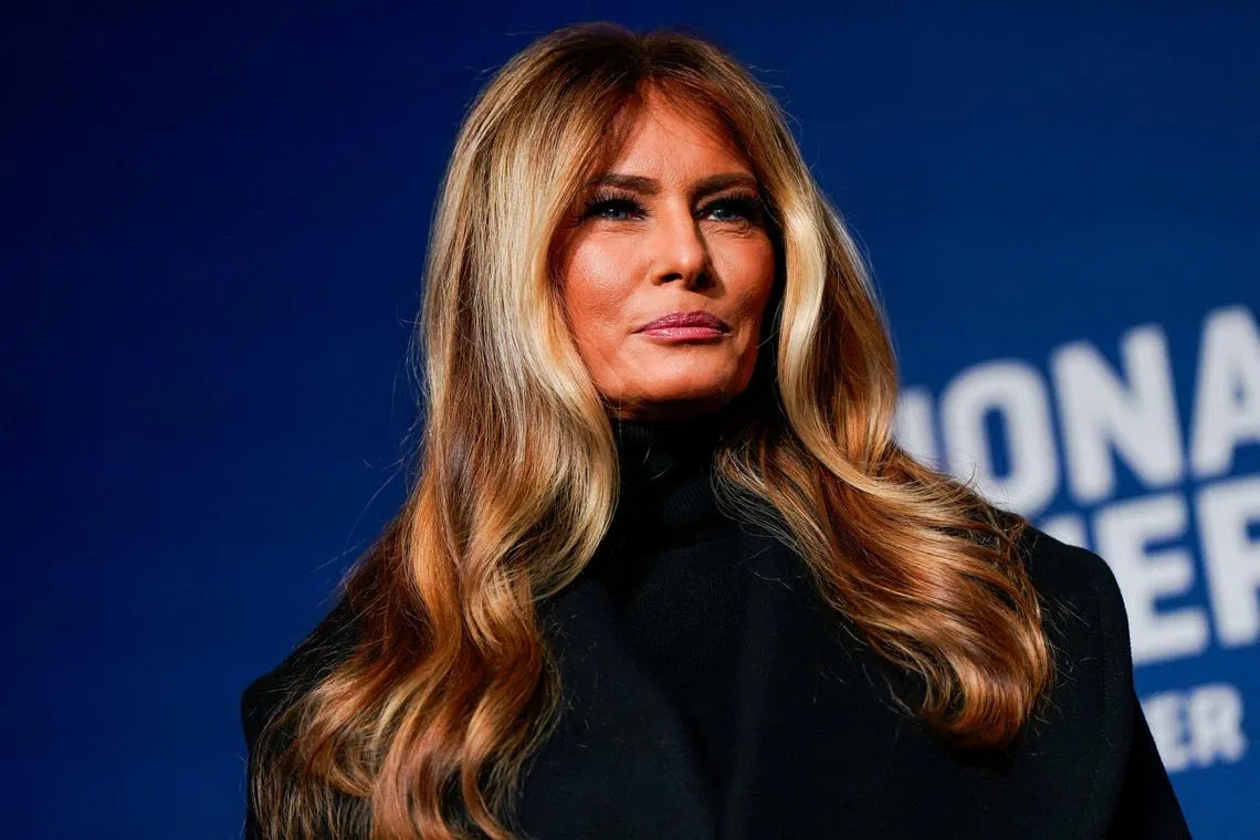 U.S. first lady Melania Trump stands next to her 2025 inaugural gown in the Flag Hall of the Smithsonian's National Museum of American History in Washington, D.C., U.S., February 20, 2026. REUTERS/Elizabeth Frantz