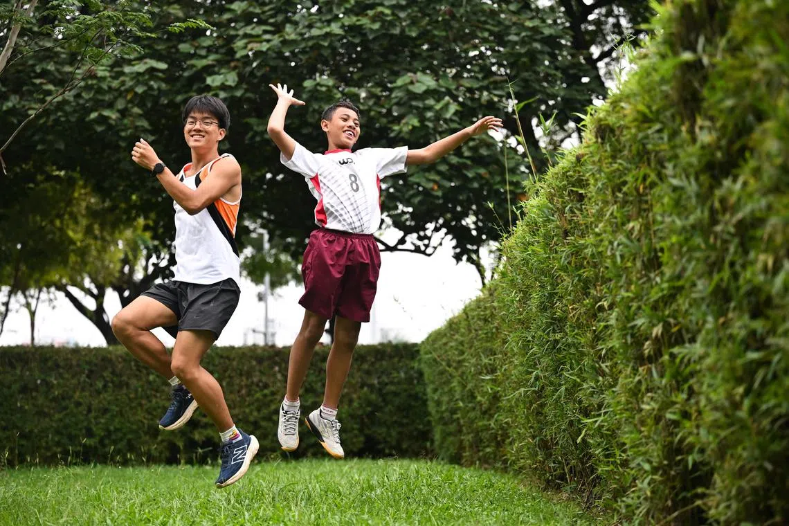 ST20250122-202527400313-Lim Yaohui-Melvyn Teoh-mtschool22/
Torch bearer and cross-country athlete Sung Yejun, 16, secondary four student from NUS High School of Mathematics and Science, with volleyball team captain Aniq Shawqi Nor Azri, 12, primary 6 student from Woodlands Primary School, posing for a photograph after attending the opening ceremony of NSG games at OCBC Arena on Jan 22, 2025.
More than 66,000 student athletes will compete across 29 sports at the National School Games (NSG) 2025. Minister for Education Mr Chan Chun Sing officiated the NSG Opening Ceremony at the Singapore Sports Hub OCBC Arena Hall on Jan 22, 2025.
The NSG, which runs from January to August this year, is Singapore’s largest and most extensive annual youth sports event with more than 250 divisional competitions for boys and girls. 
(ST PHOTO: LIM YAOHUI)