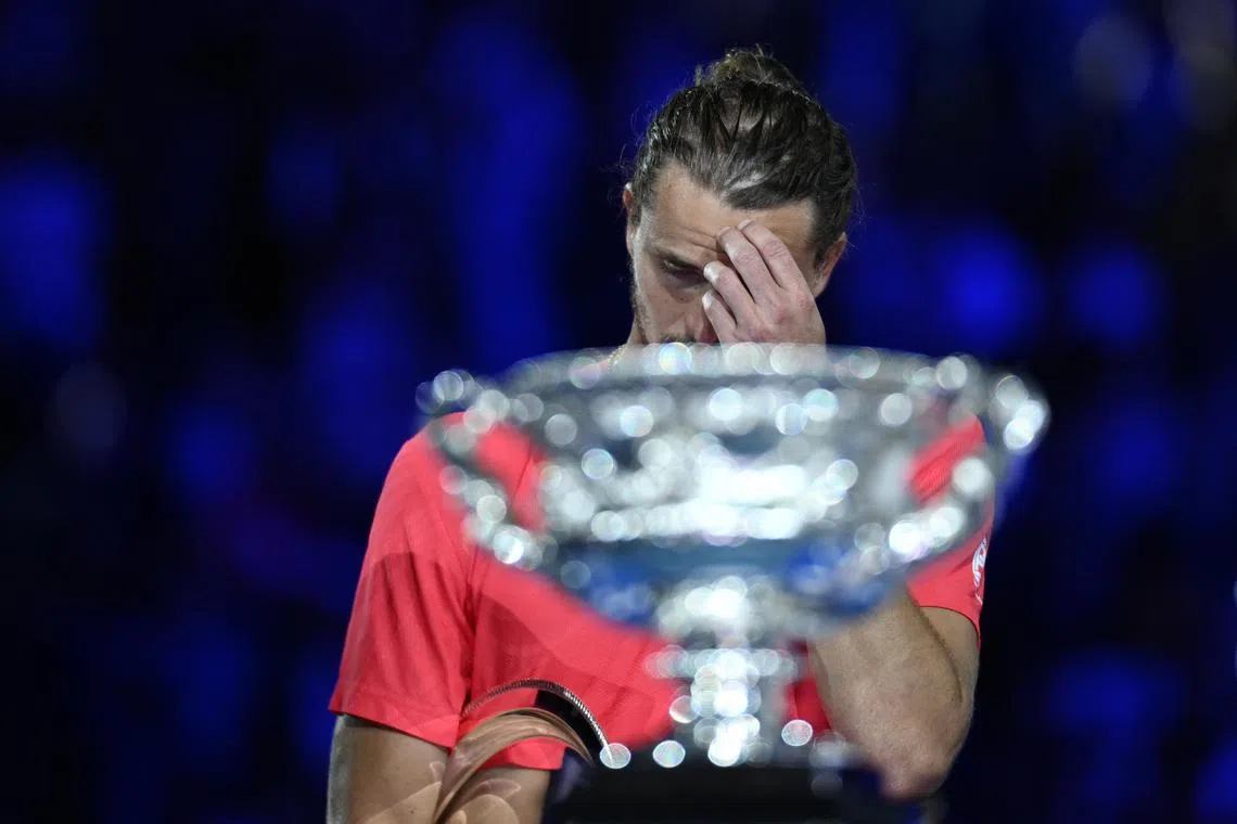 Runner-up Alexander Zverev of Germany gesturing during the trophy ceremony after losing after the men's singles final match against Jannik Sinner of Italy at the Australian Open Grand Slam tennis tournament in Melbourne, Australia, on Jan 26.