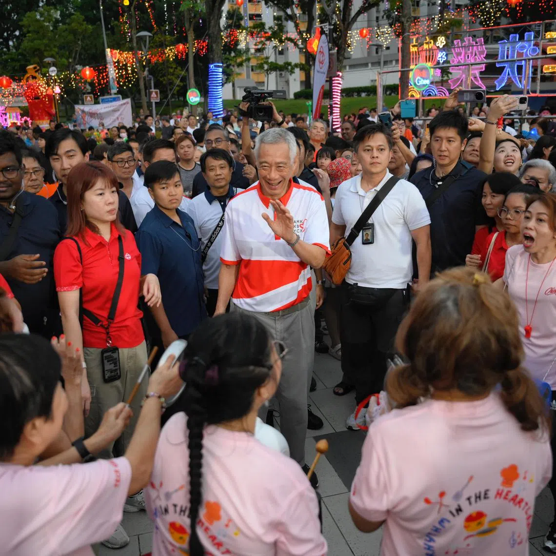 Senior Minister and Ang Mo Kio GRC MP Lee Hsien Loong greets guests and performers during the first stop of Chingay 2025@ Ang Mo GRC, Kebun Bahru GRC, and Yio Chu Kang SMCs, held at Teck Ghee Square on Feb 15, 2025.