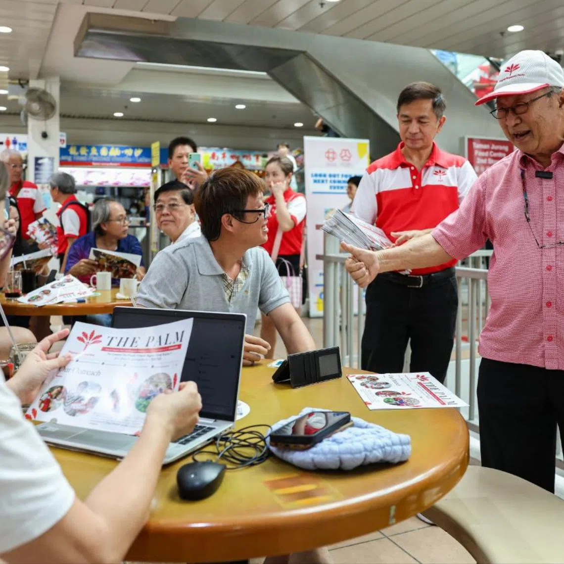 Progress Singapore Party chairman Tan Cheng Bock (right) greeting Taman Jurong residents during his party's walkabout at Taman Jurong Market & Food Centre on March 16.