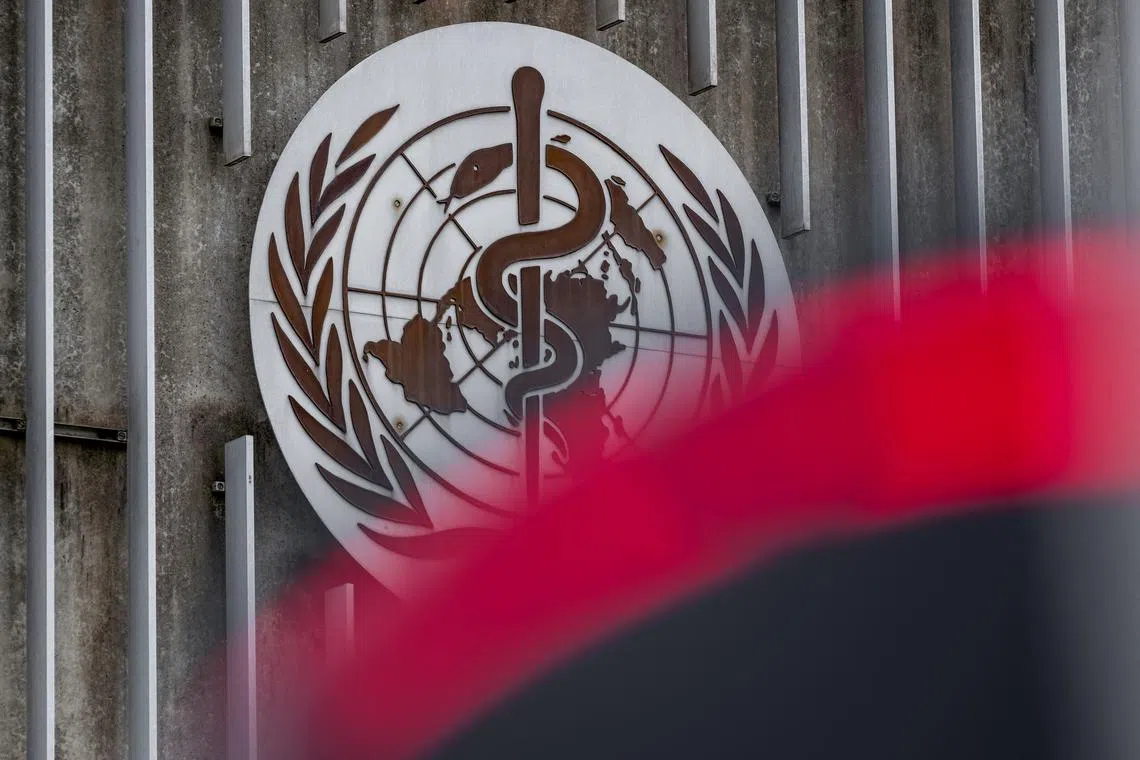 This photograph taken on April 23, 2025 shows a sign of the World Health Organisation (WHO) next to their headquarters in Geneva. The Director-General of the WHO said on April 22, 2025, that US budget cuts were leaving the UN agency's accounts in the red, forcing it to reduce its operations and lay off staff. (Photo by Fabrice COFFRINI / AFP)