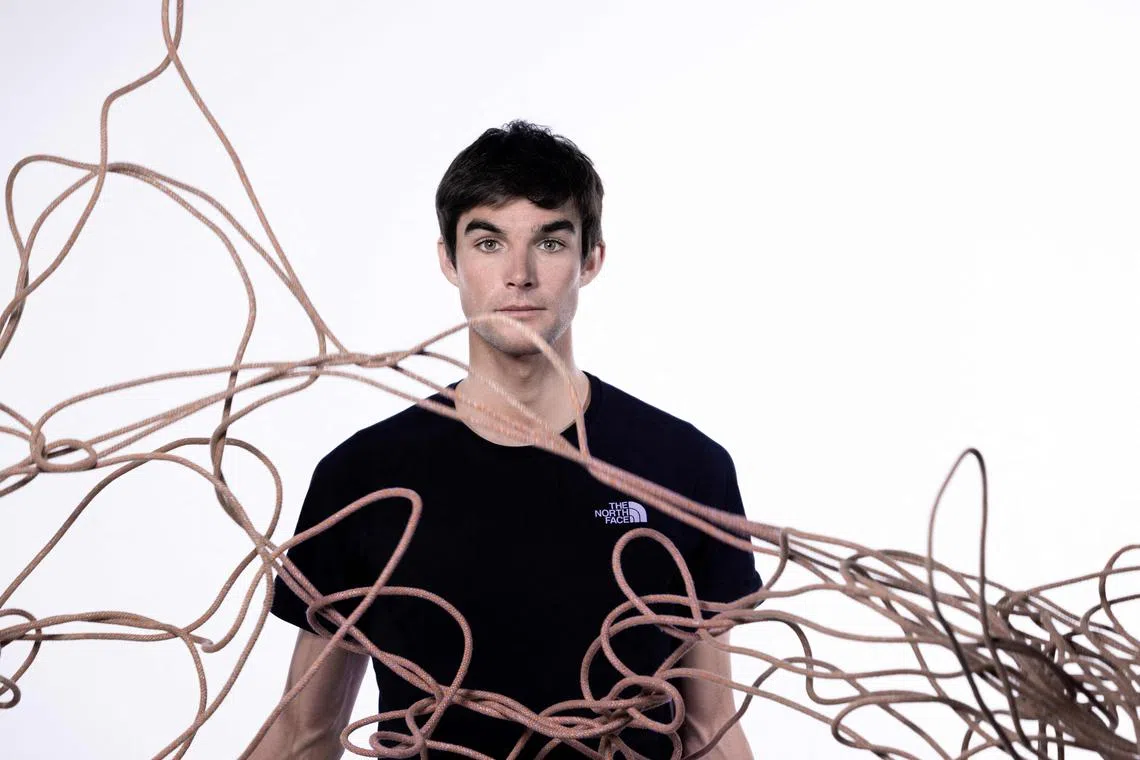 (FILES) French alpinist, climber, skier, paraglider and mountains guide Benjamin Vedrines, poses during a photo session in Paris on April 11, 2023. One of the greatest French alpinists, high mountain guide Benjamin Vedrines, is preparing to set out next month to conquer the formidable K2 in Pakistan, which he wants to climb without oxygen and in less than 24 hours. (Photo by JOEL SAGET / AFP)