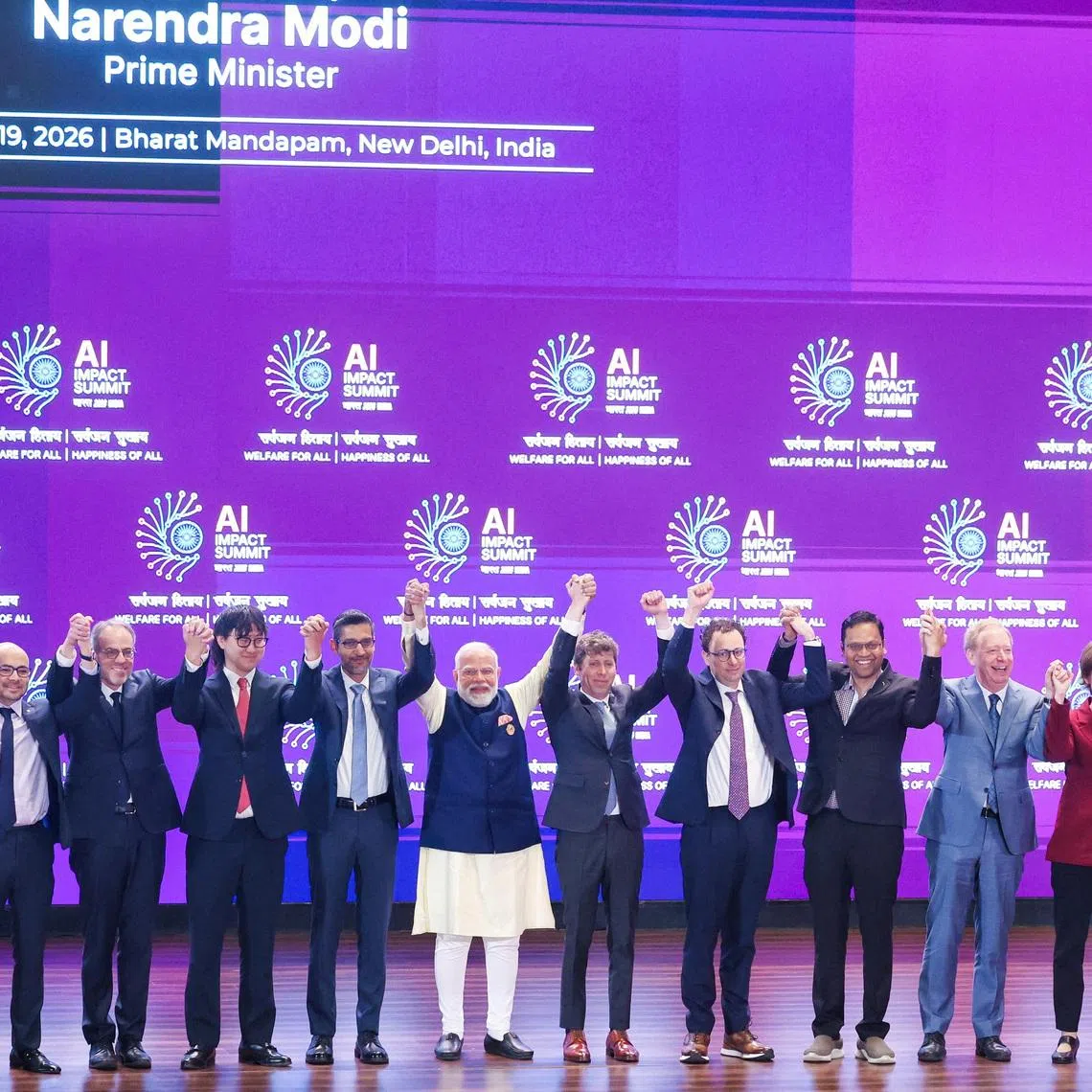Indian PM Narendra Modi (seventh from left) and global tech leaders at the AI Impact Summit in New Delhi on Feb 19.