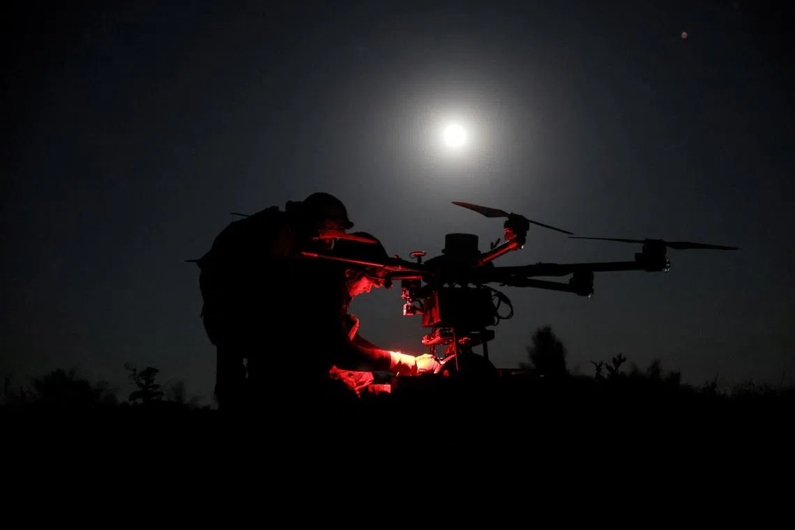 Servicemen of 24th Mechanized Brigade named after King Danylo of the Ukrainian Armed Forces prepare a Kazhan heavy combat drone before flying it over positions of Russian troops, amid Russia's attack on Ukraine, near the frontline town of Chasiv Yar in Donetsk region, Ukraine May 15, 2025. Oleg Petrasiuk/Press Service of the 24th King Danylo Separate Mechanized Brigade of the Ukrainian Armed Forces/Handout via REUTERS