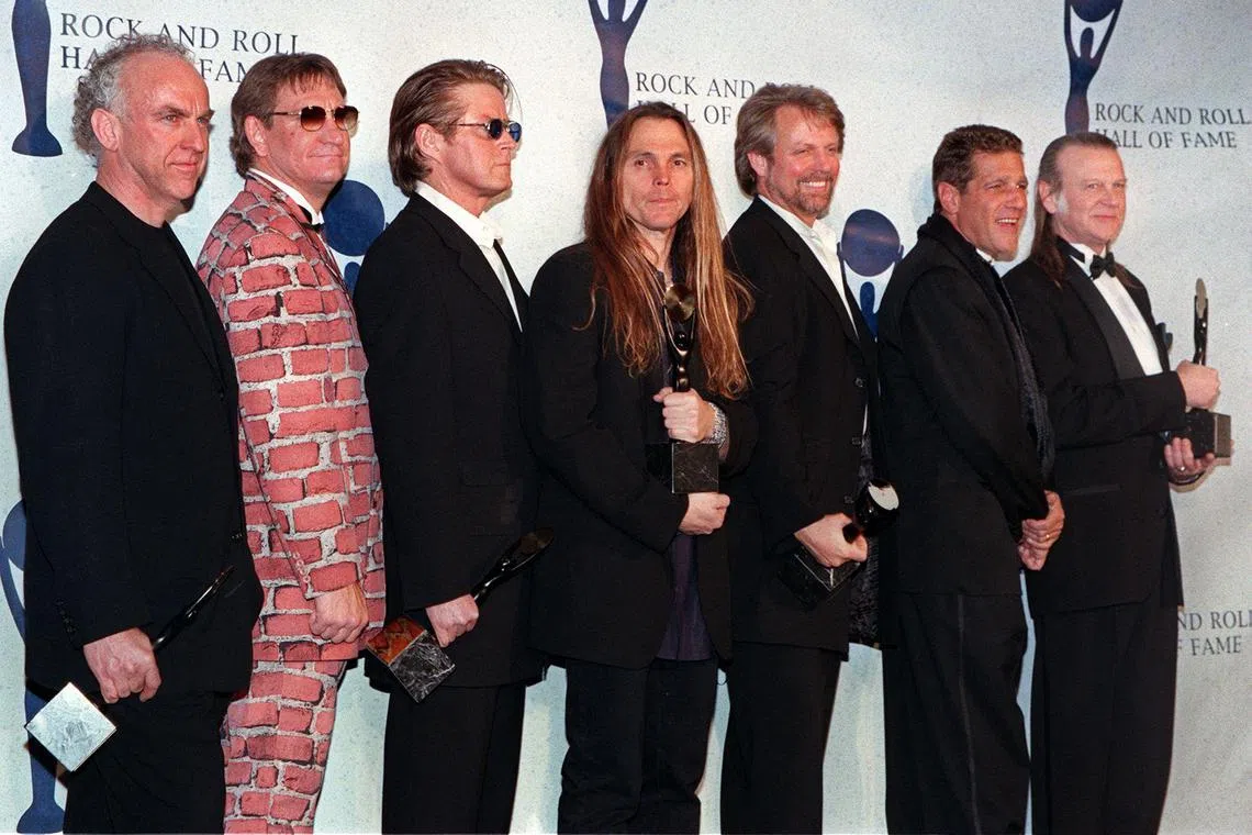 (FILES) The Eagles (from left:) Bernie Leadon, Joe Walsh, Don Henley, Timothy Schmit, Don Felder, and Randy Meisner appear together after receiving their awards and being inducted into the Rock & Roll Hall of Fame, January 12, 1998 in New York. 