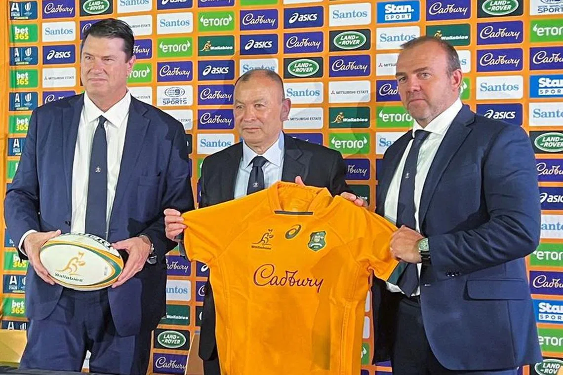 FILE PHOTO: New Australia rugby union coach Eddie Jones poses with Rugby Australia Chairman Hamish McLennan and CEO Andy Marinos after his first news conference since his reappointment, which was held at Matraville Sports High School, in Sydney, Australia January 31, 2023. REUTERS/Nick Mulvenney/File Photo