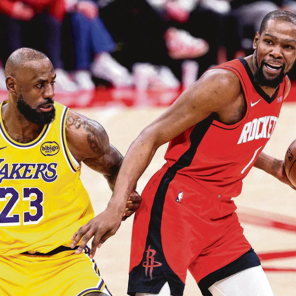 LeBron James of the Los Angeles Lakers defends Kevin Durant of the Houston Rockets during an NBA game at Toyota Center on March 16, 2026.