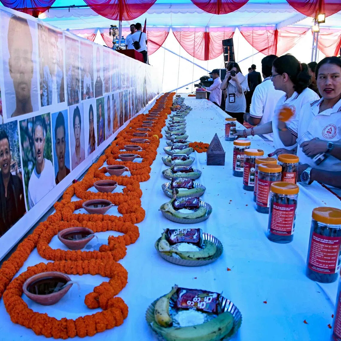 People pay homage to victims who lost their lives in the 2025 anti-corruption Gen-Z protests, during a memorial in Kathmandu on Sept 8.