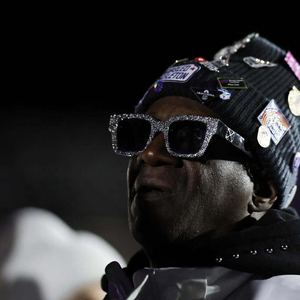 Milano Cortina 2026 Olympics - Bobsleigh - Women's Monobob Victory Ceremony - Cortina Sliding Centre, Cortina d'Ampezzo, Italy - February 16, 2026. Rapper Flavor Flav watches the victory ceremony. REUTERS/Athit Perawongmetha/File Photo