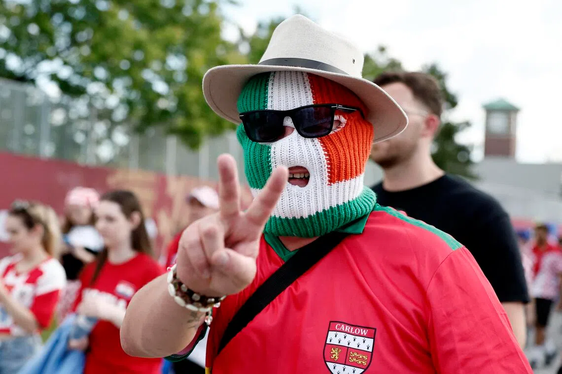 A Republic of Ireland fan wearing a balaclava outside the stadium in June 2026. Ireland are due to play Israel on Sept 27.