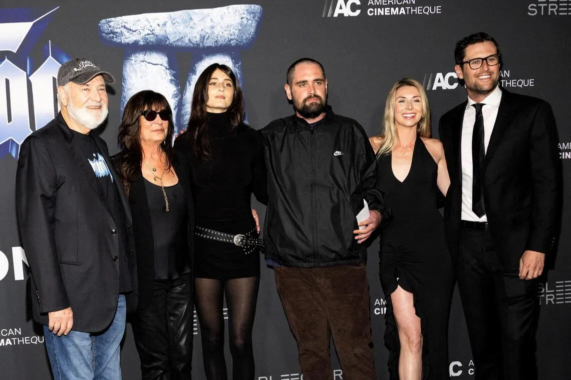 Rob Reiner (left) and his son, Nick (fourth from left) at the premiere of Spinal Tap II: The End Continues.
