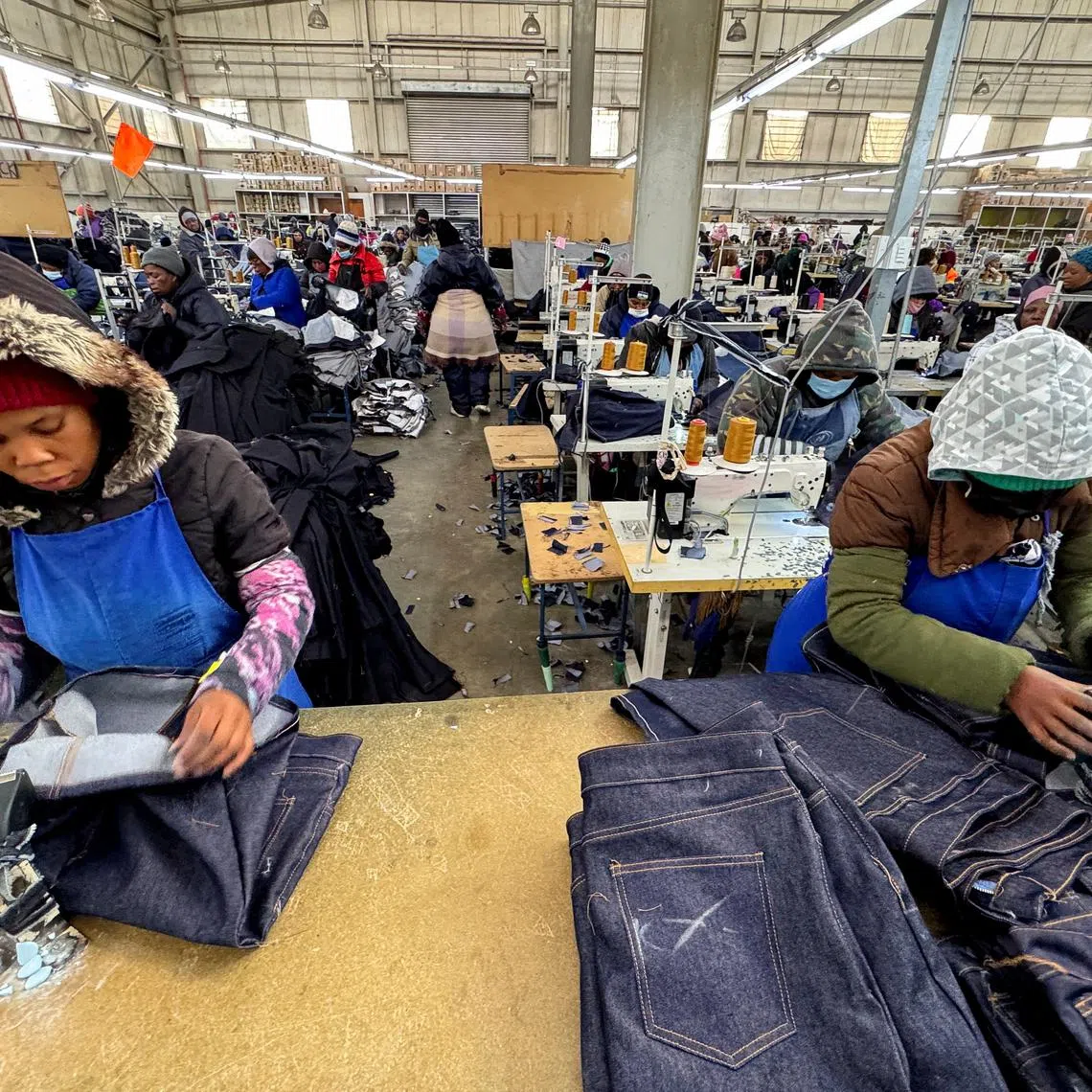 Workers execute their duties at the Afri-Expo Textile Factory, which makes clothing for the U.S. market, on the outskirts of Maseru, the capital of Lesotho, July 9, 2025. REUTERS/Siyabonga Sishi/File Photo