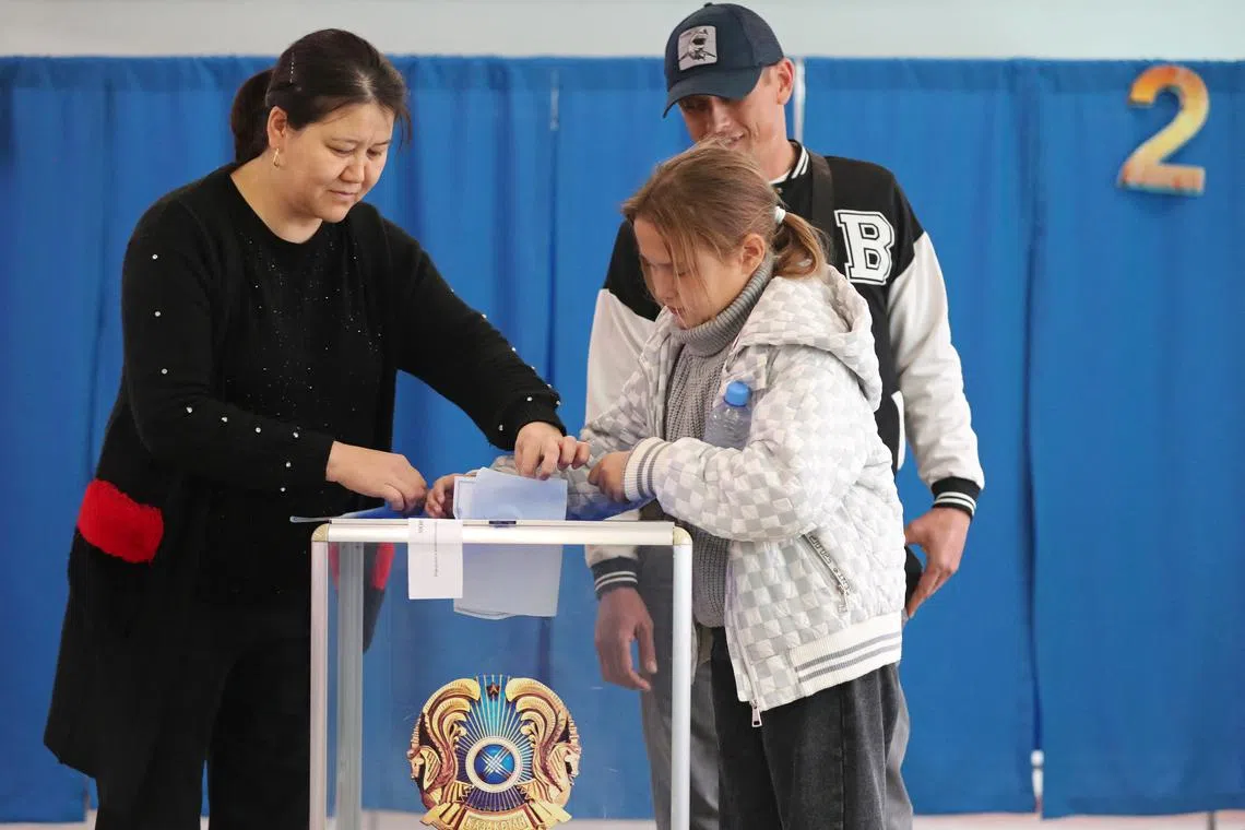 People cast their votes during a referendum on the construction of a nuclear power plant, at a polling station in the village of Ulken in the Almaty Region, Kazakhstan October 6, 2024. REUTERS/Pavel Mikheyev