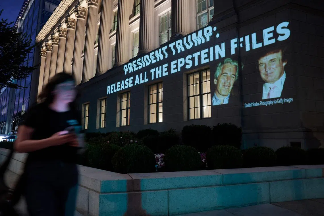 An image of US President Donald Trump and disgraced financier Jeffrey Epstein, along with the words President Trump: Release All the Epstein Files, is projected onto the US Department of Commerce headquarters on July 18.