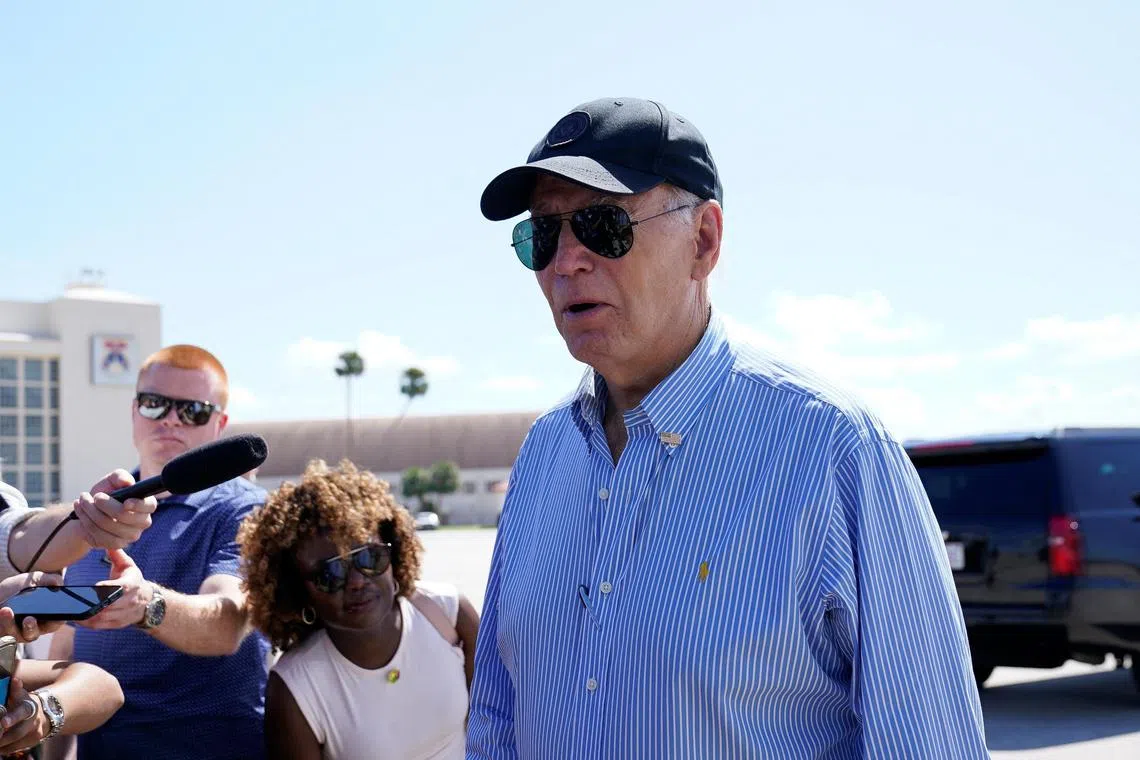 US President Joe Biden before boarding Air Force One after visiting storm-damaged areas by Hurricanes Milton and Helene, at MacDill Air Force Base in Tampa, Florida, on Oct 13.