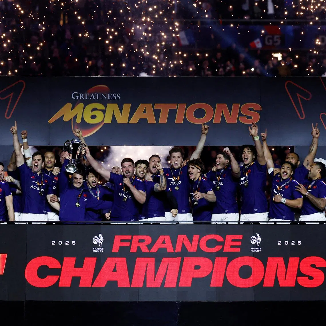 Rugby Union - Six Nations Championship - France v Scotland - Stade de France, Saint-Denis, France - March 15, 2025 France's Antoine Dupont and Gregory Alldritt lift the Six Nations trophy as they celebrate on the podium with their teammates REUTERS/Stephanie Lecocq