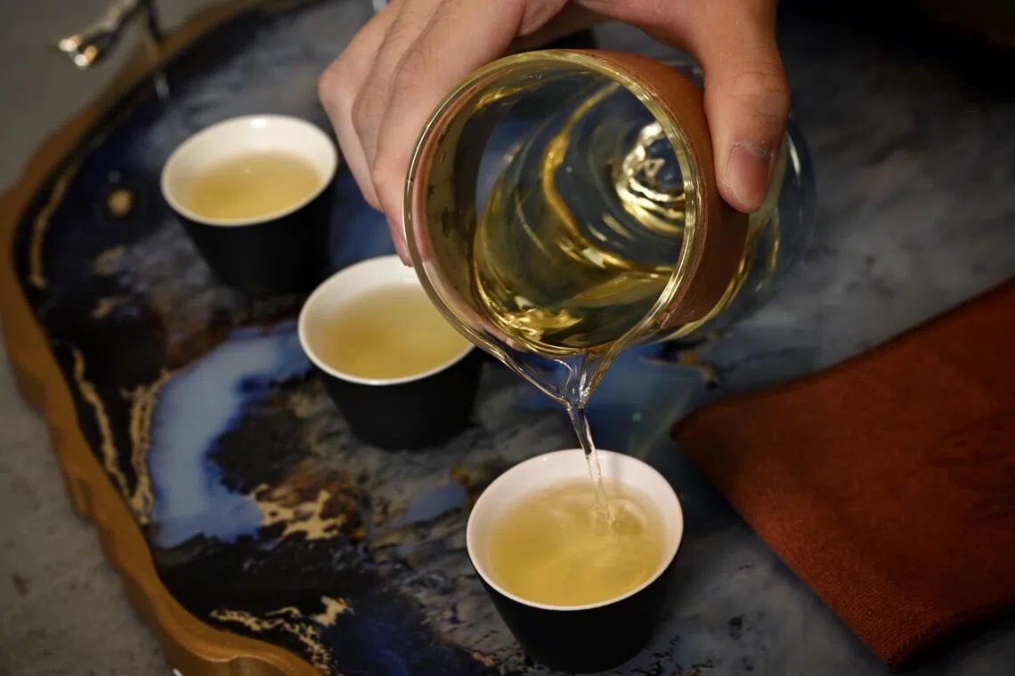 Vincent Tay pouring Long Jing (Dragon Well) tea.