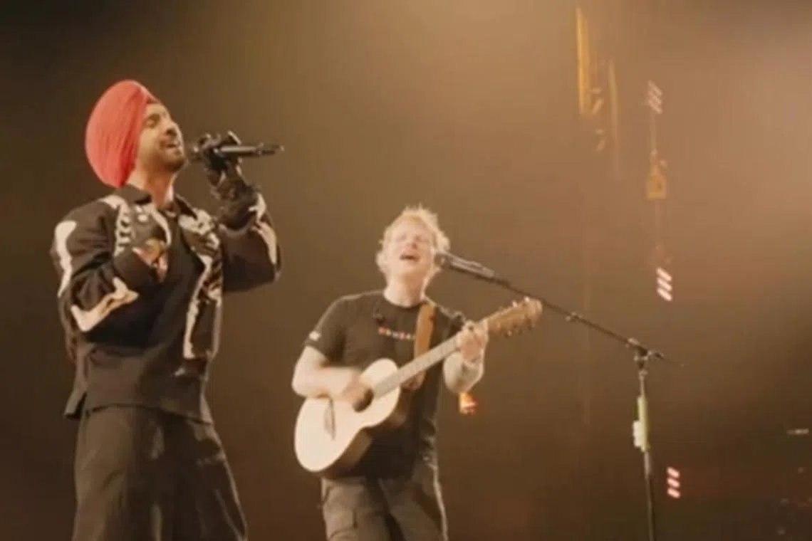 Indian singer Diljit Dosanjh (left) at Ed Sheeran's concert in Mumbai on March 16.