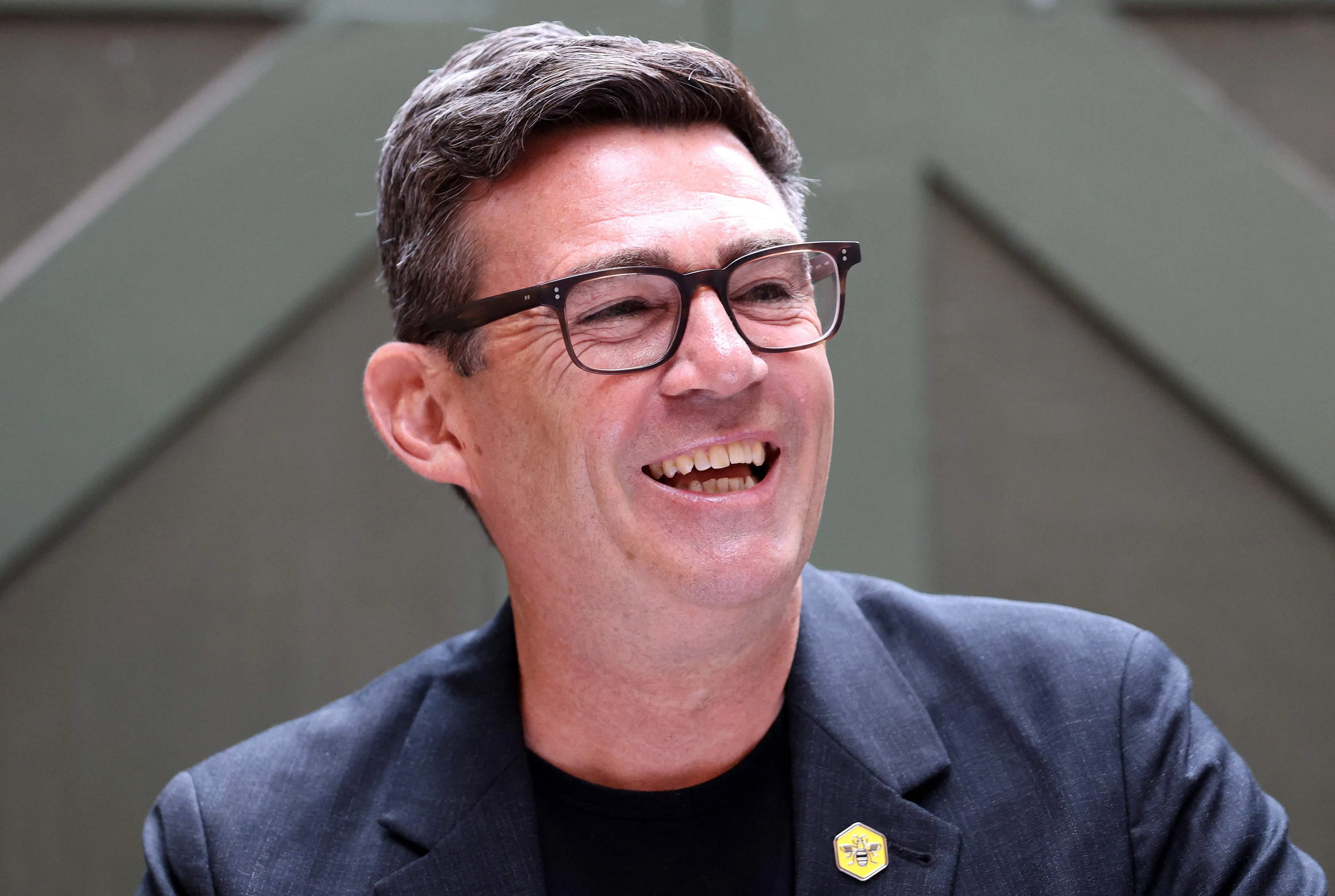 (FILES) Labour MP and challenger for leader of the Labour party, Andy Burnham, laughs as he delivers a speech in Manchester, northern England, on June 29, 2026. Burnham will take another step towards becoming the UK's next prime minister when nominations to replace Keir Starmer as Labour leader formally open on July 9, 2026. (Photo by Toby Shepheard / AFP)