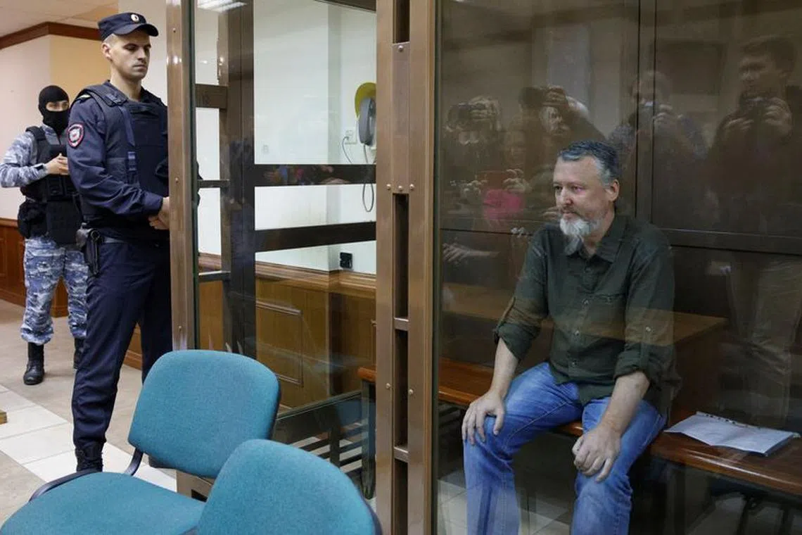 Russian nationalist Kremlin critic and former military commander Igor Girkin, also known as Igor Strelkov, who is charged with inciting extremist activity, sits behind a glass wall of an enclosure for defendants during a court hearing to consider an appeal against his detention, in Moscow, Russia August 29, 2023. REUTERS/Maxim Shemetov