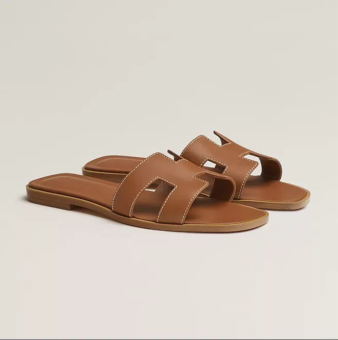 Hermes Oran Sandal in Gold ($1,200).