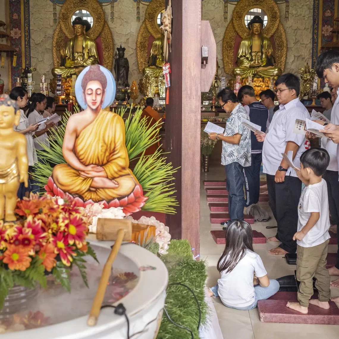 Devotees taking part in Vesak Day celebrations at a temple in Denpasar, Bali, Indonesia, on June 4, 2023. Buddhists celebrate Vesak Day to mark the date of the birth, enlightenment and passing of Buddha.