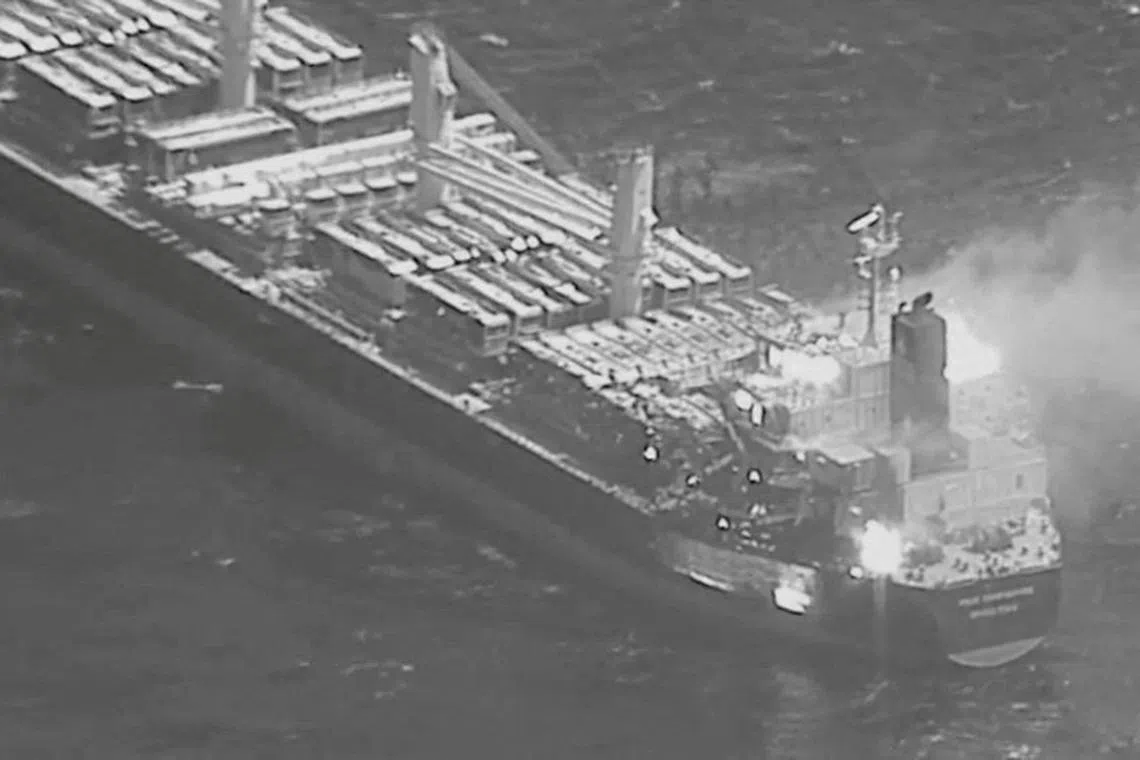 An aerial view of the Barbados-flagged ship True Confidence ablaze following a Houthi missile attack at sea, March 6, 2024, in this handout photo. DVIDS/Handout via REUTERS