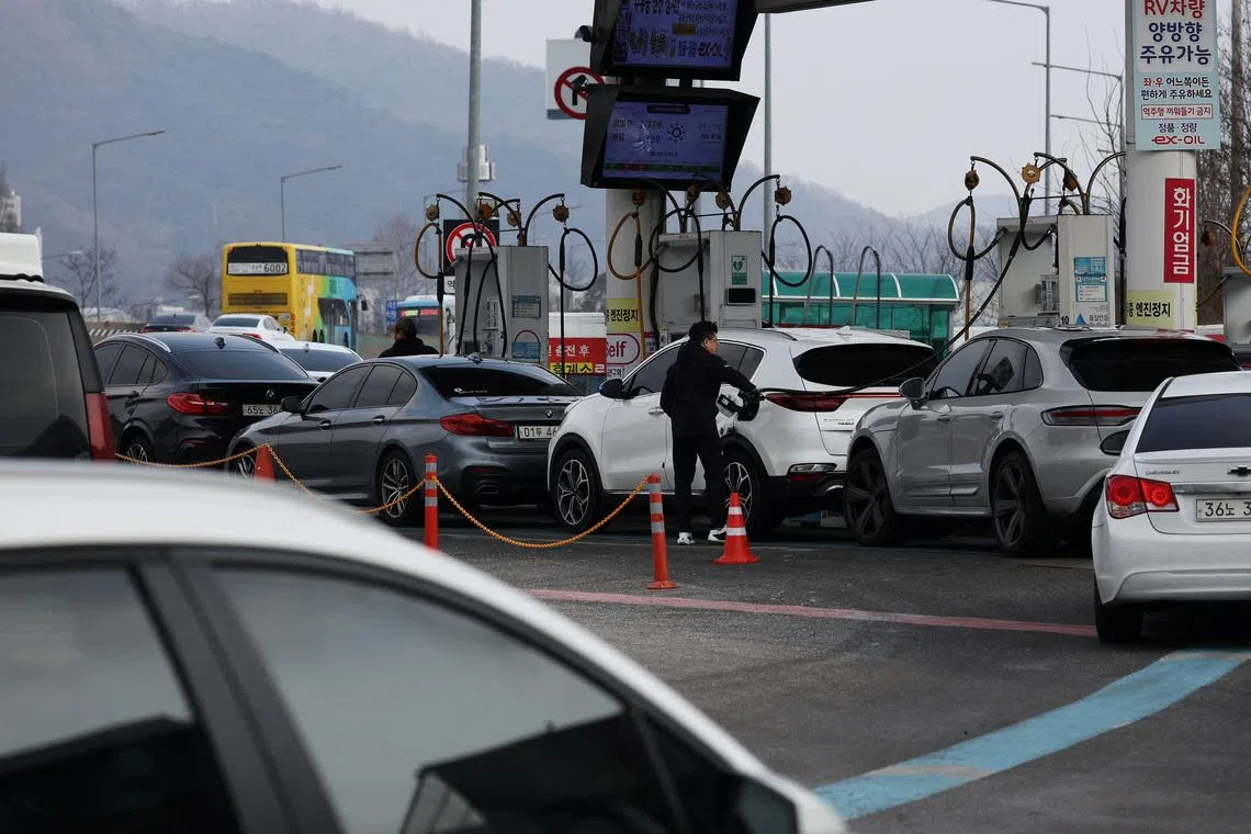A man fills up his car at a gas station in Seoul, South Korea, March 9, 2026.   REUTERS/Kim Hong-Ji