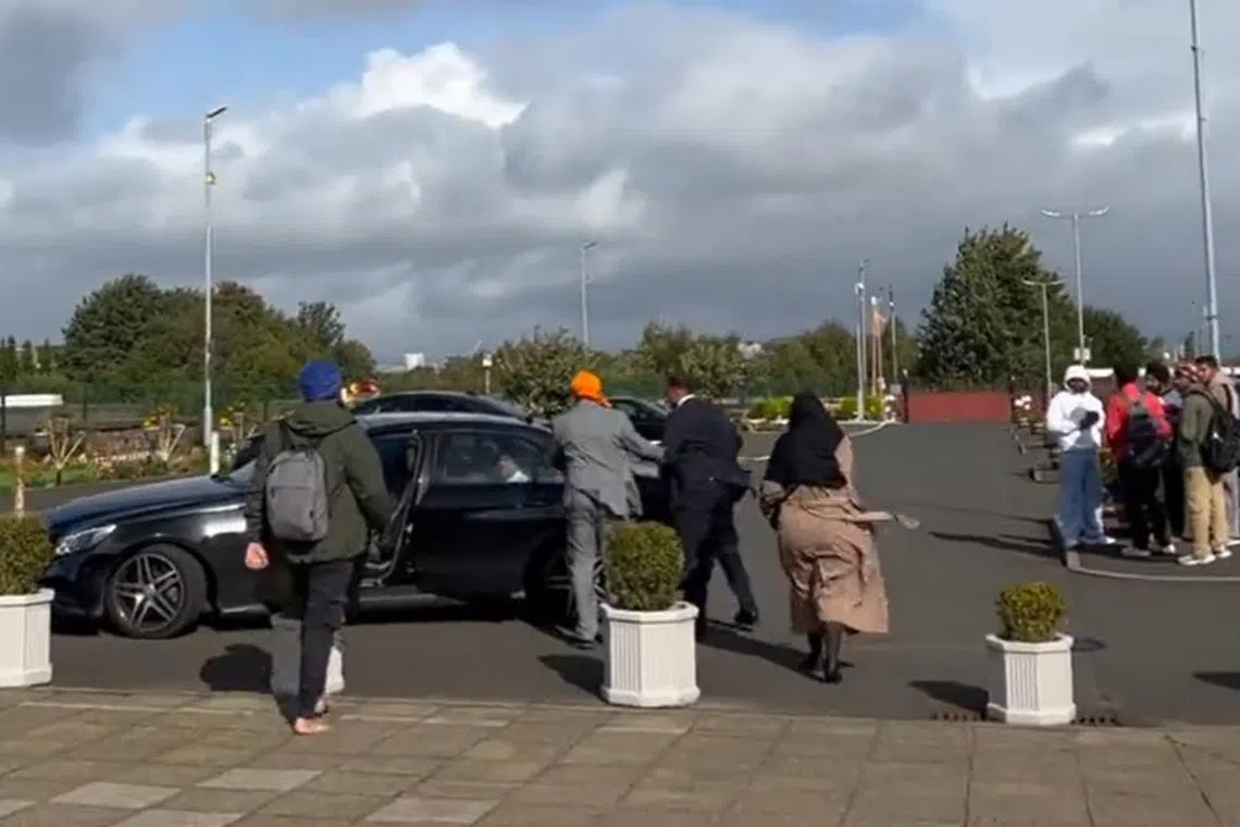 One of three protesters reportedly tried to open the door of Mr Doraiswami’s car, prompting officials to abandon the visit.