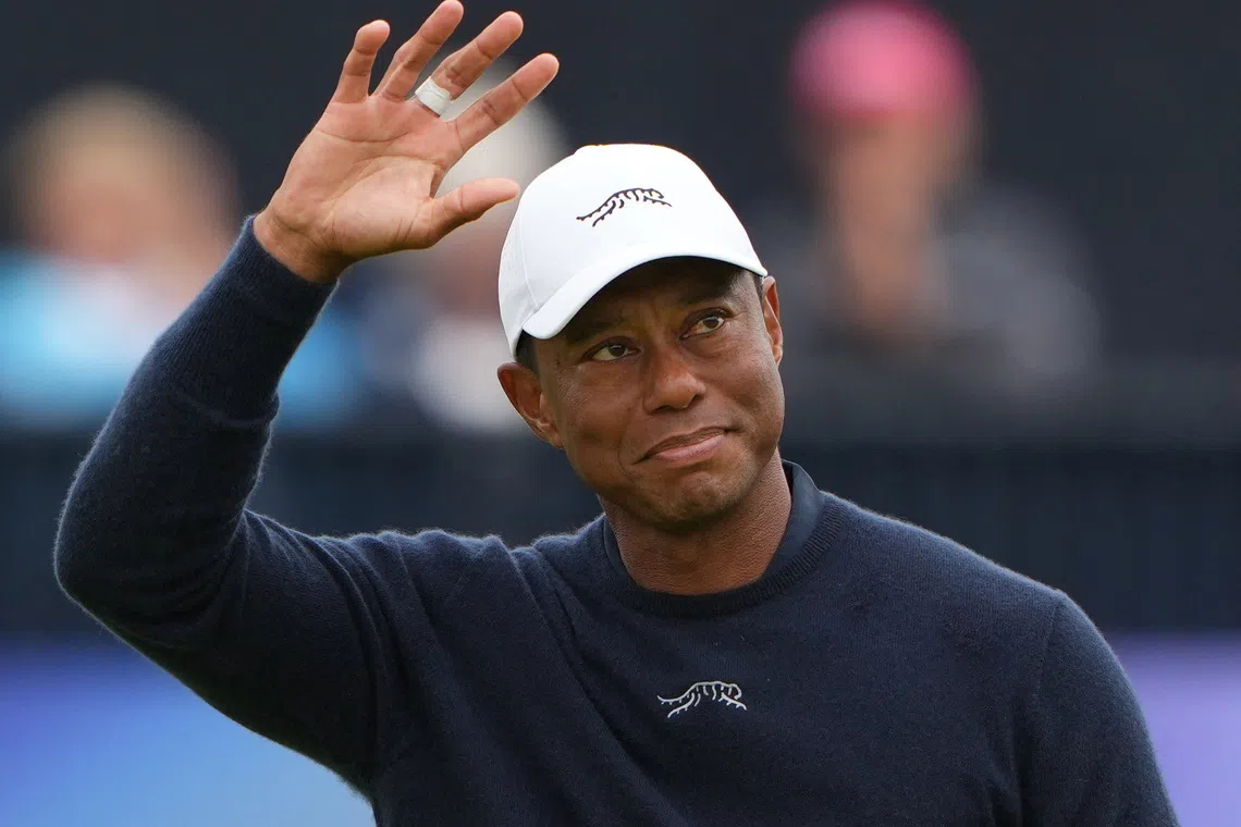 Golf - The 152nd Open Championship - Royal Troon Golf Club, Troon, Scotland, Britain - July 19, 2024 Tiger Woods of the U.S. acknowledges the crowd at the 18th green after finishing his second round REUTERS/Maja Smiejkowska