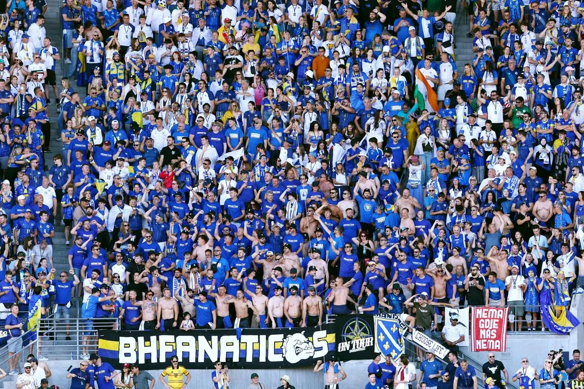 FILE PHOTO: Soccer Football - FIFA World Cup 2026 - Group B - Bosnia and Herzegovina v Qatar - Seattle Stadium, Seattle, Washington, U.S. - June 24, 2026 Bosnia and Herzegovina fans celebrate after Bosnia and Herzegovina's Kerim Alajbegovic scores their first goal REUTERS/Eloisa Lopez/File Photo