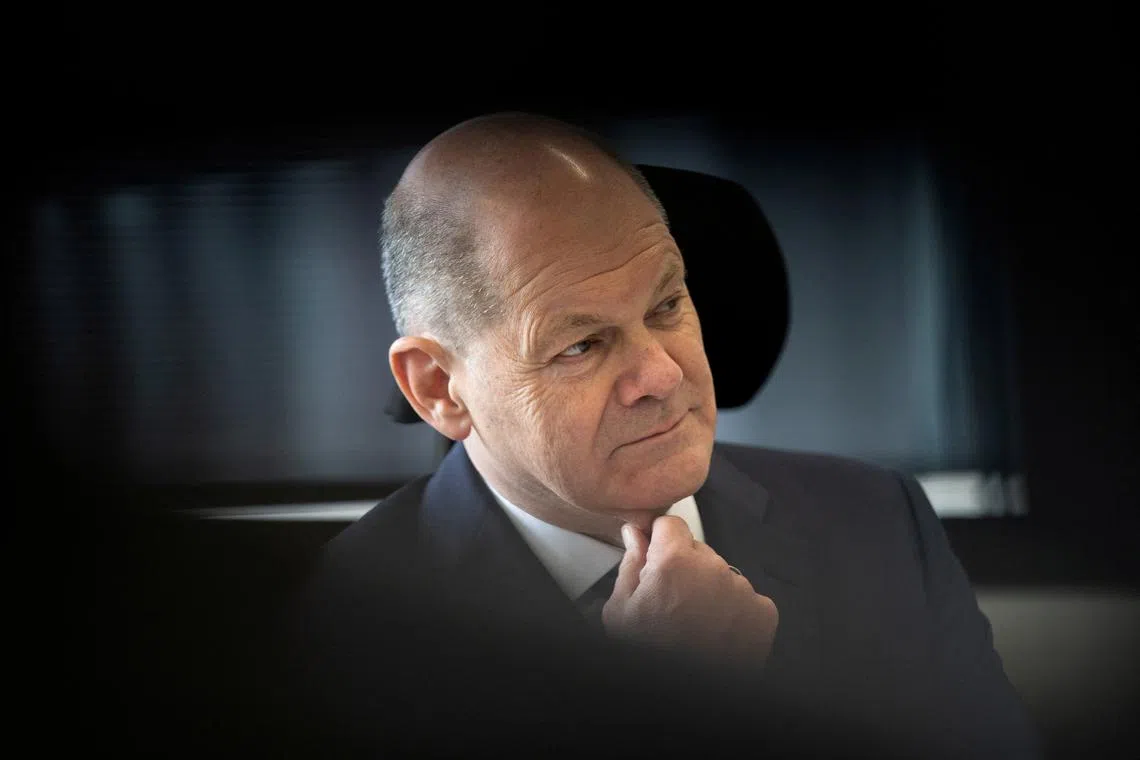 FILE PHOTO: German Chancellor Olaf Scholz listens during his visit of Germany's Federal Criminal Police Office Bundeskriminalamt or BKA in Wiesbaden, Germany, April 25, 2024. Boris Roessler/Pool via REUTERS/File Photo