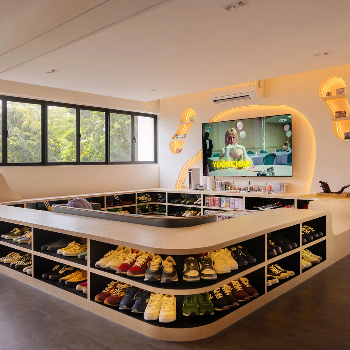 The centrepiece of this HDB flat is a conversation pit with eclectic seating that reflects the family’s playful, informal personality and love of sneakers. 