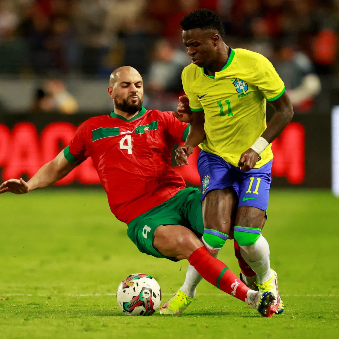 Soccer Football - International Friendly - Morocco v Brazil - Grand Stade de Tanger, Tangier, Morocco - March 25, 2023 Morocco's Sofyan Amrabat fouls Brazil's Vinicius Junior REUTERS/Juan Medina     TPX IMAGES OF THE DAY