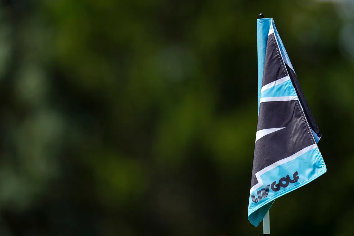 Aug 22, 2025; Detroit, Michigan, USA;  The LIV Golf logo is seen on the 14th green pin flag during the quarterfinals of the LIV Golf Michigan Team Championship at The Cardinal at Saint John's Resort. Mandatory Credit: Aaron Doster-Imagn Images